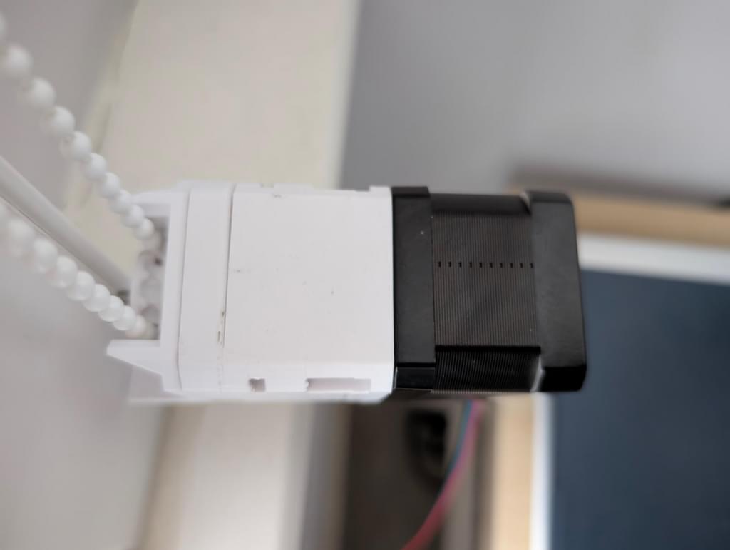 View from the top showing the gear meshing with the blind's bead chain.